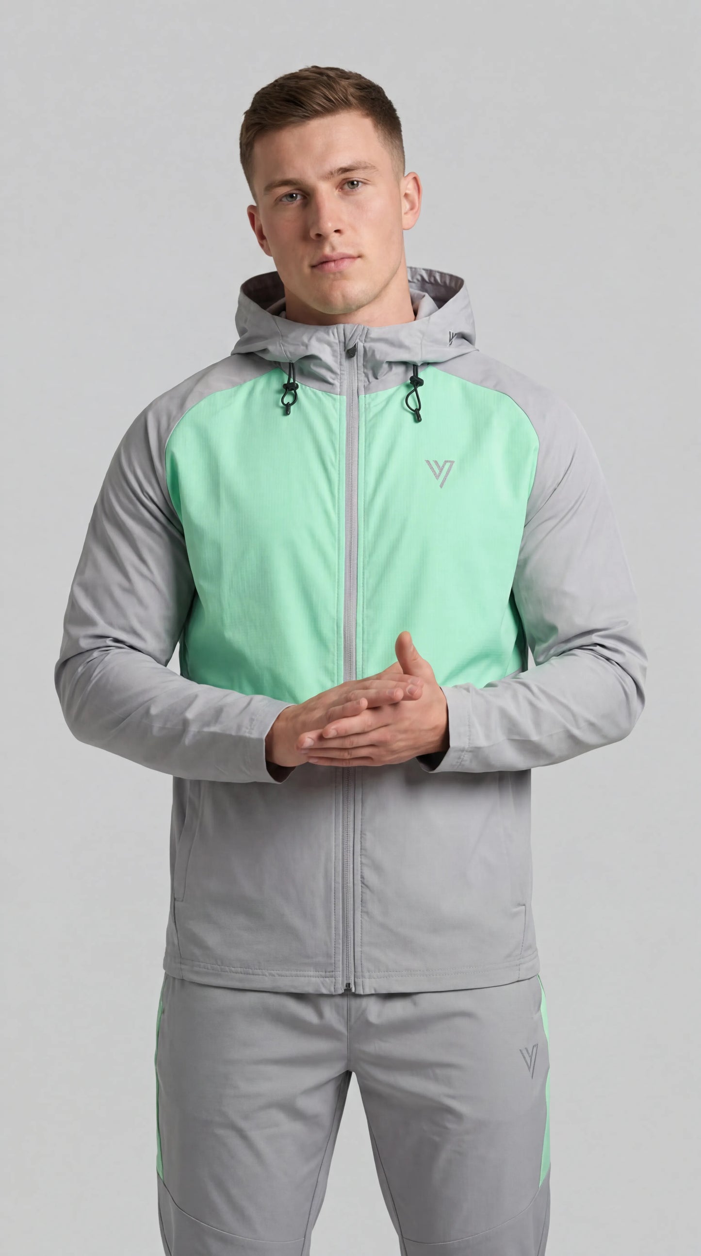 Model wearing the Grey/Mint Velum Tracksuit