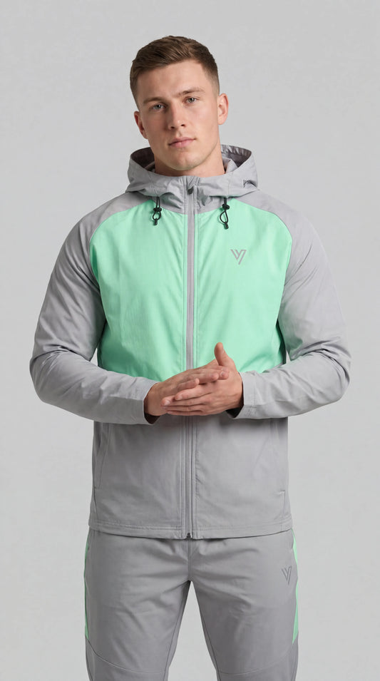 Model wearing the Grey/Mint Velum Tracksuit